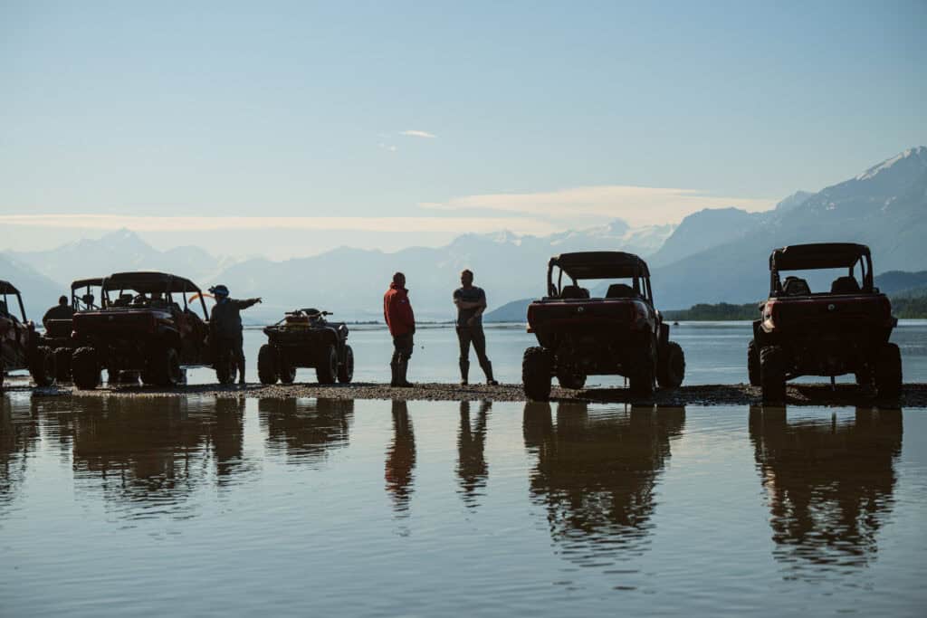 atvs reflecting in the knik river on a perfect day