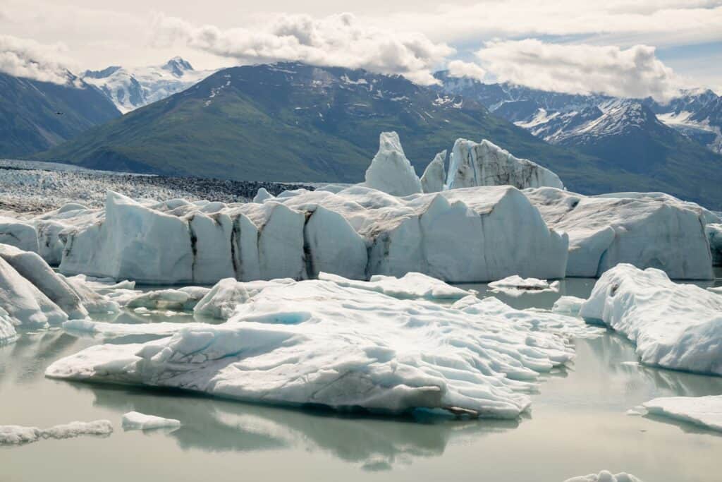 icebergs floating in the knik glacier lake in alaska